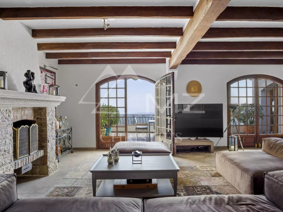 Interior of a Provençal villa with a spacious living room and sea view