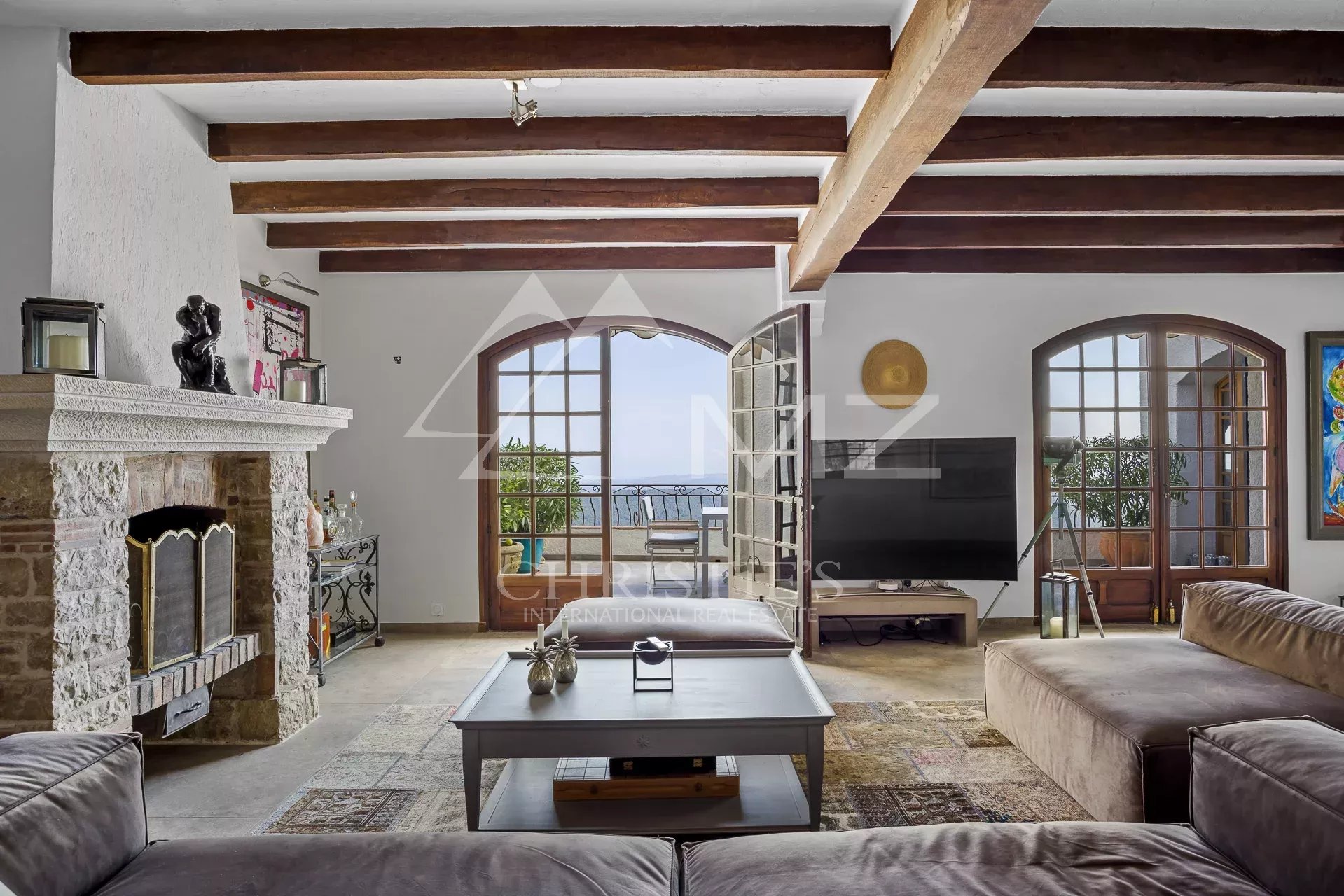 Interior of a Provençal villa with a spacious living room and sea view