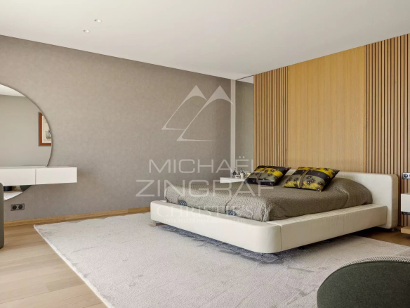 Modern bedroom with bed and minimalist decor in a contemporary villa.