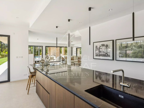Interior of a contemporary villa with open kitchen and bright living room in Fayence.
