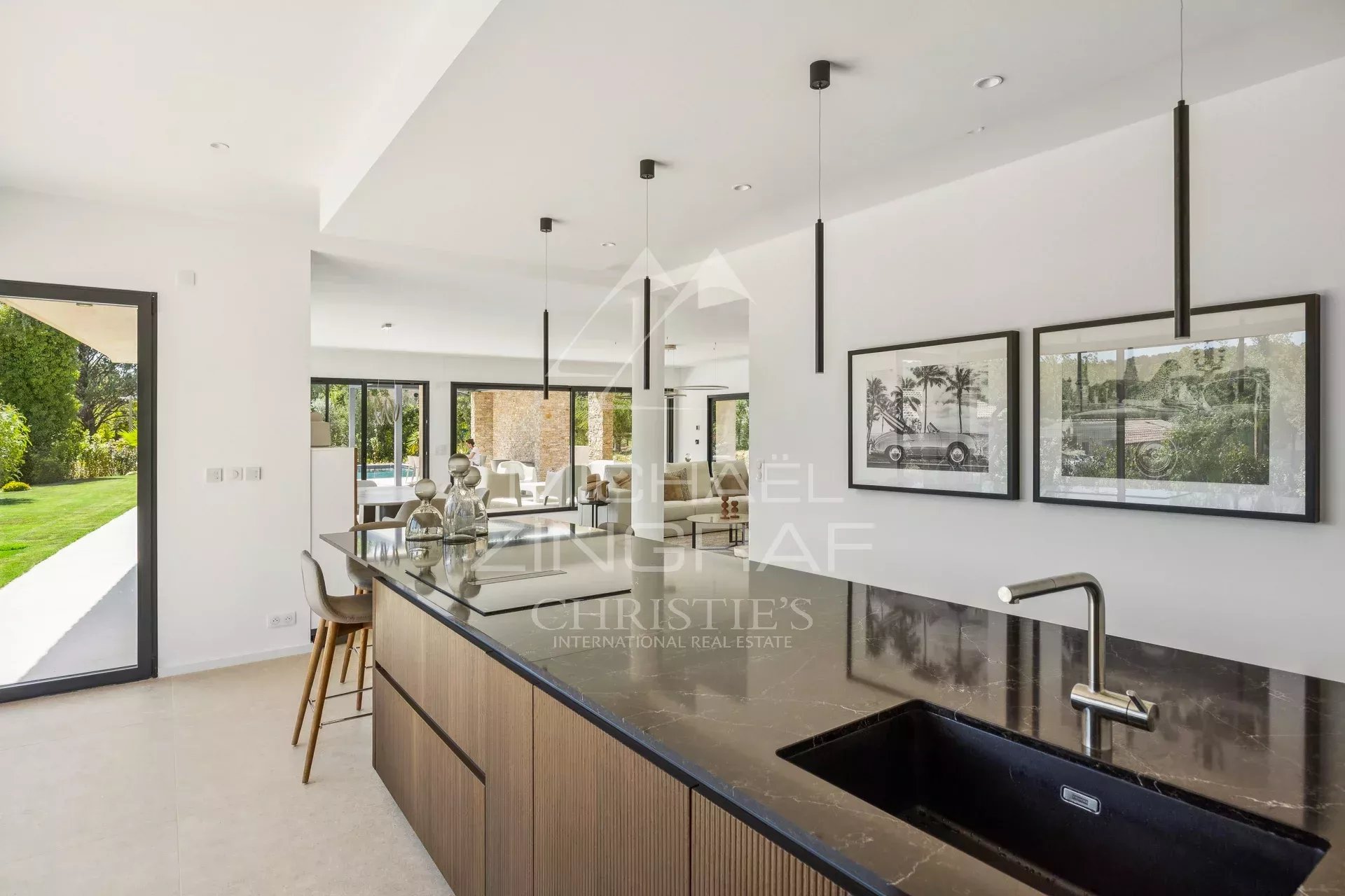 Interior of a contemporary villa with open kitchen and bright living room in Fayence.