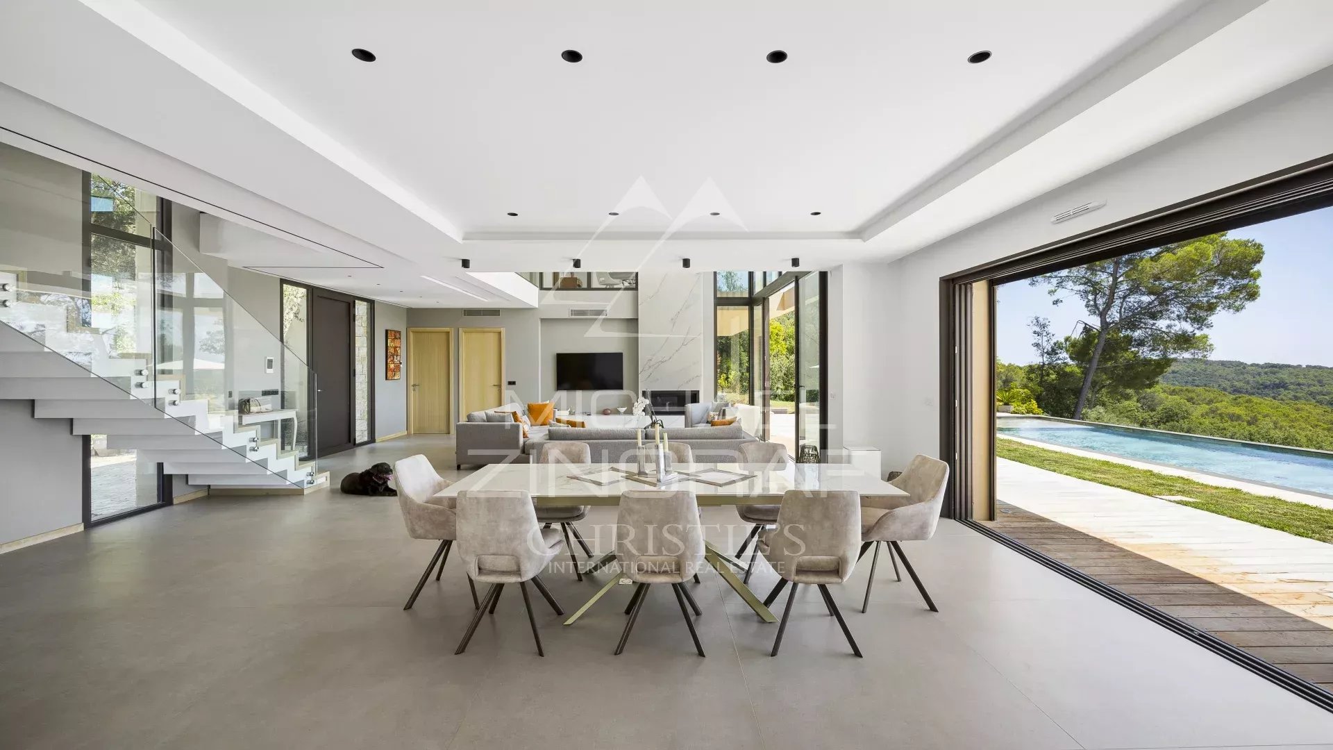 Interior of a contemporary villa in Roquefort-les-Pins with panoramic views and bright space.