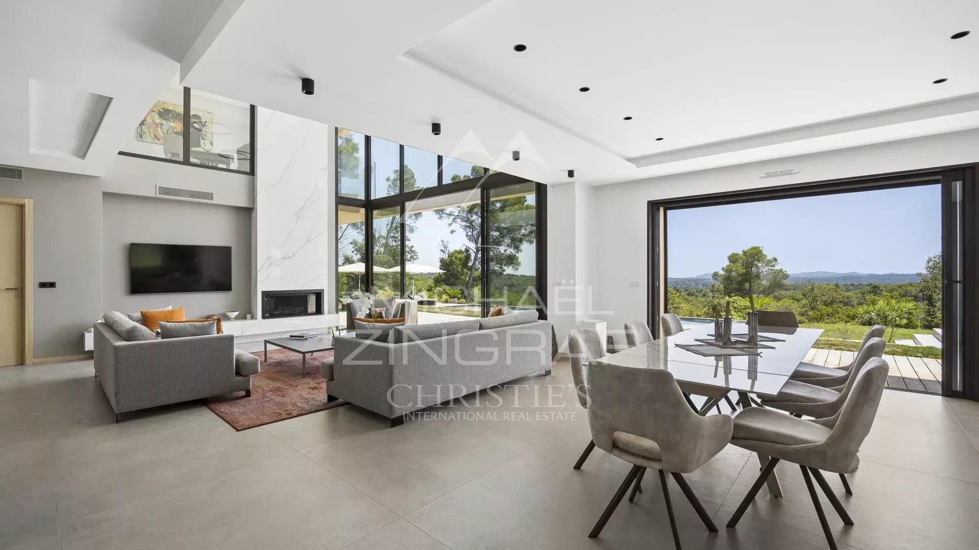Interior of a contemporary villa in Roquefort-les-Pins with panoramic views of the valley.