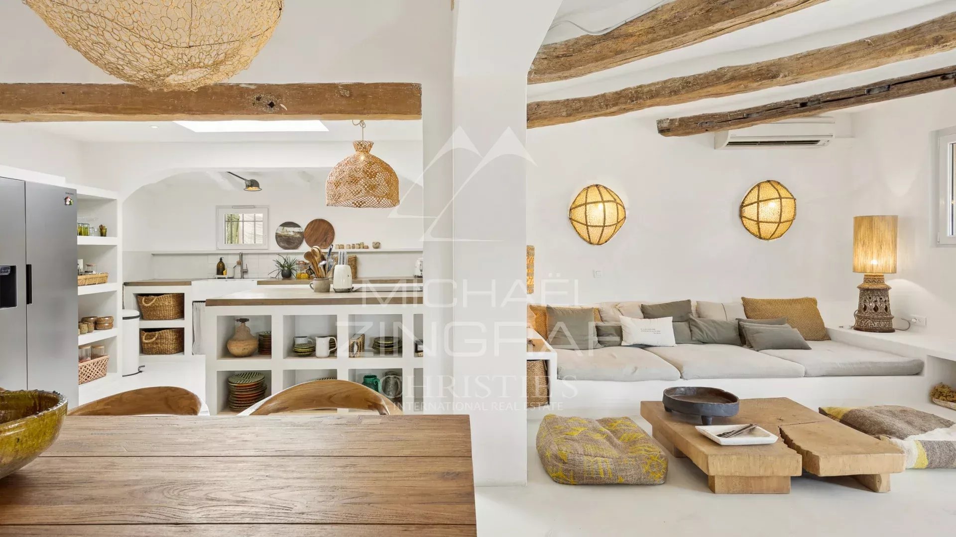Interior of a Mediterranean villa Interior of a Mediterranean villa with living room and kitchen, decorated with natural materials.