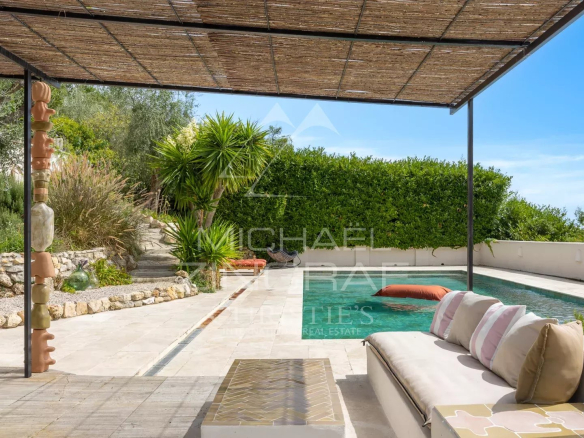 Terrace with swimming pool and outdoor lounge in a Mediterranean villa in Le Rouret.