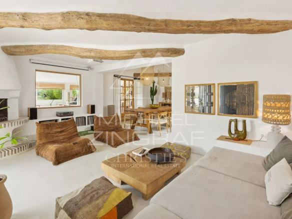 Interior of a Mediterranean villa with exposed beams and soothing decor.