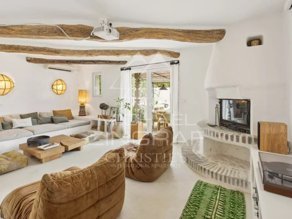 Interior of a Mediterranean villa with a bright living room and fireplace