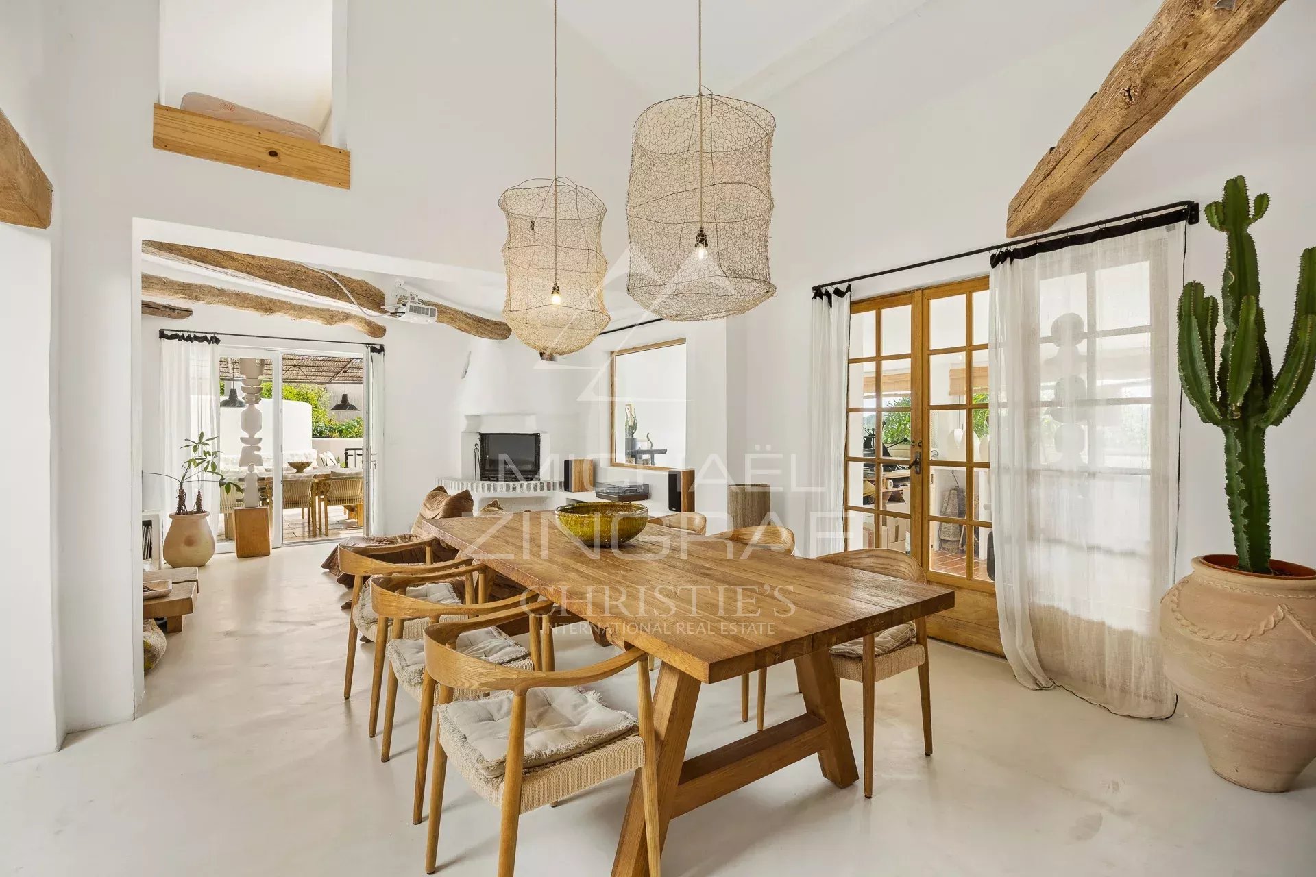 Interior of a Mediterranean villa Interior of a Mediterranean villa with a wooden dining room and bright decor.