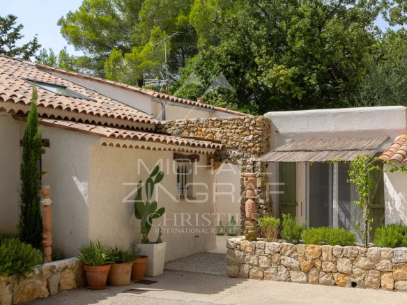 Mediterranean villa with garden, located in Le Rouret, surrounded by greenery.