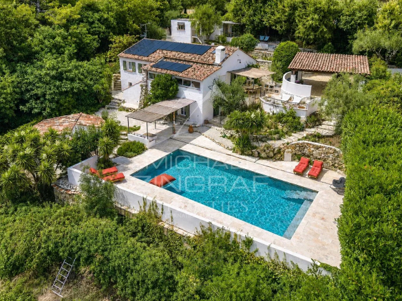 Aerial view of a Mediterranean villa with swimming pool and garden in Le Rouret.