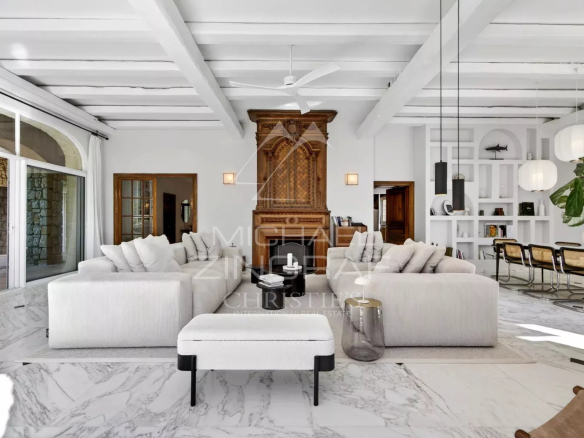 Interior of a renovated property with a spacious and elegant living room, decorated in a modern style.