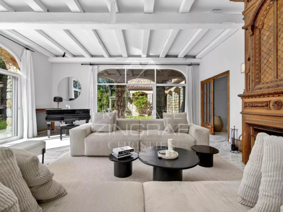 Interior of a renovated property with a bright living room and modern furniture in Le Bar-sur-Loup.