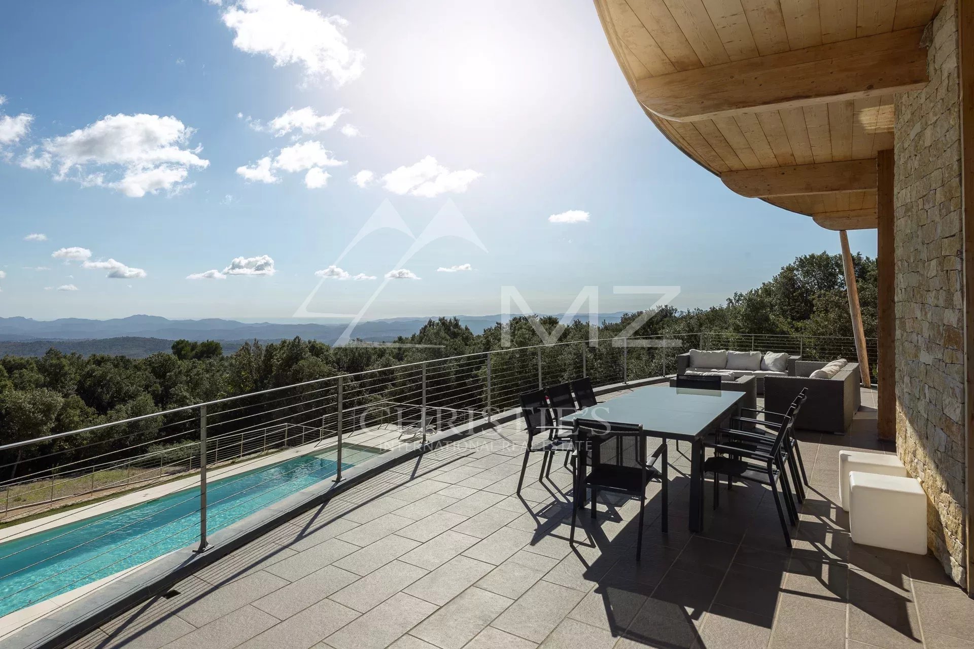 Panoramic view from a villa with terrace and swimming pool in Fayence.