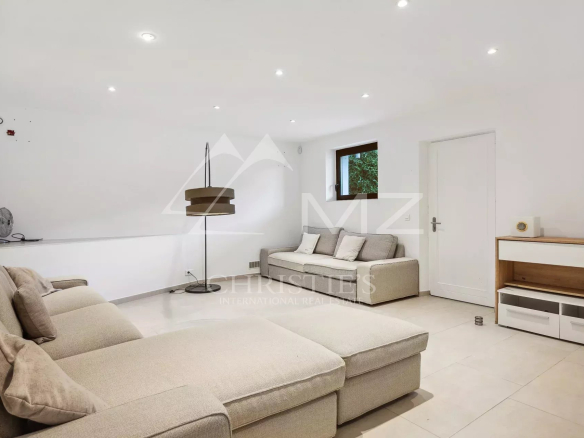 Interior of a property with sofa and modern lighting in Fayence.