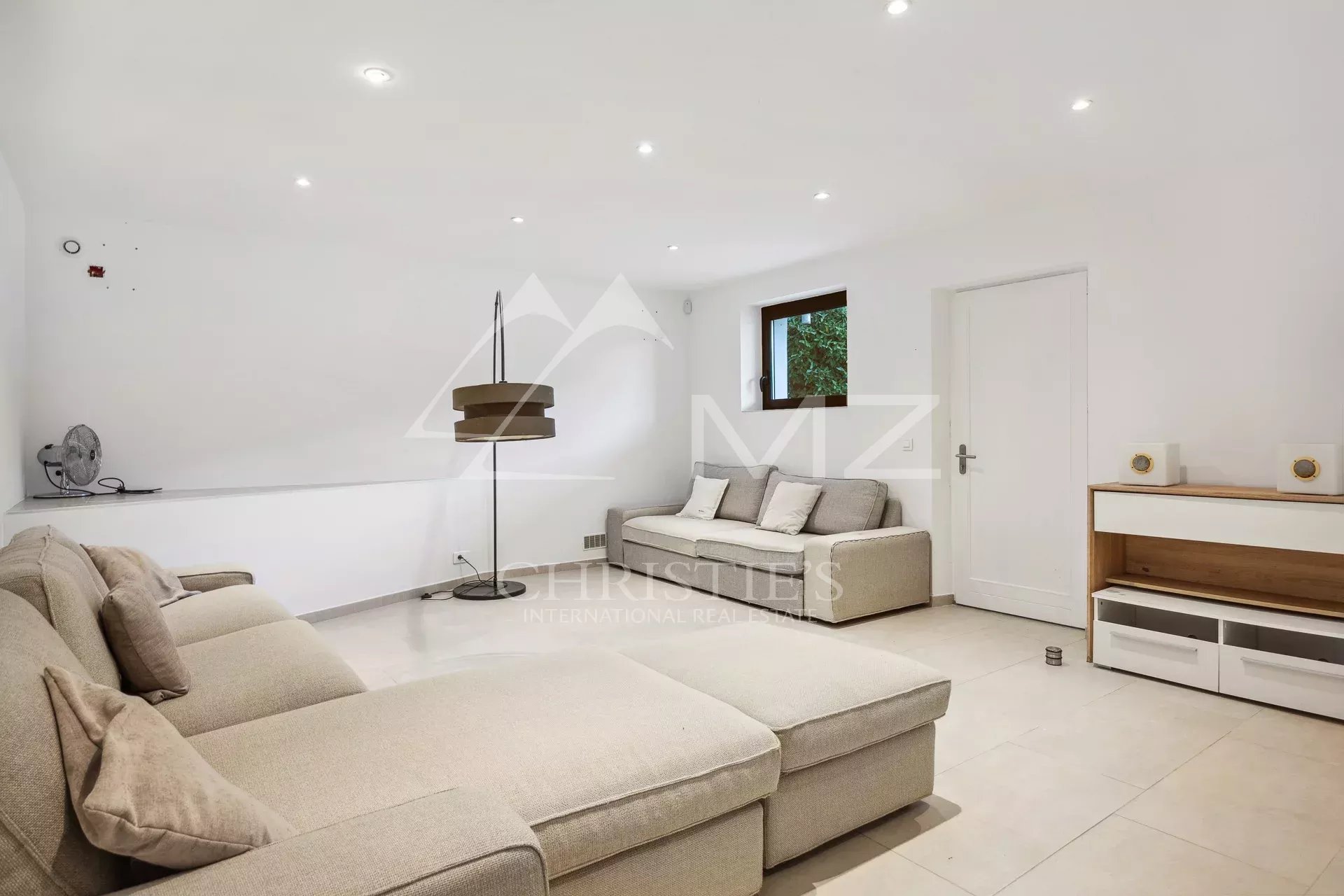 Interior of a property with sofa and modern lighting in Fayence.