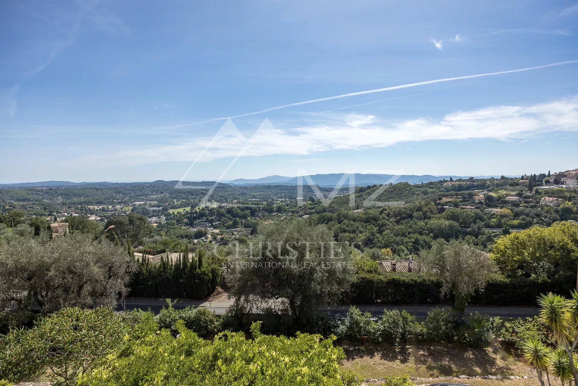 Panoramic view from the villa Panoramic view from a villa in Châteauneuf-Grasse, with green landscapes and clear skies.