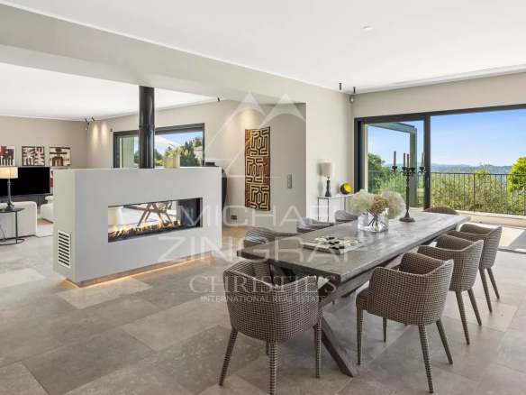 Interior of a modern villa with sea view, living room and dining room.