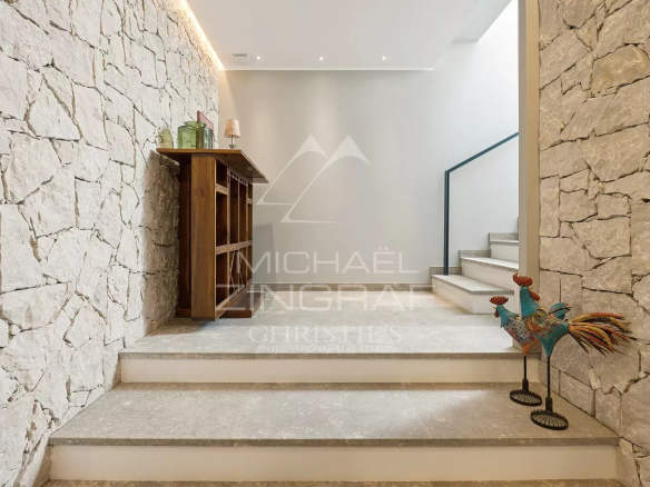 Interior of a villa with staircase and stone walls in Châteauneuf-Grasse.