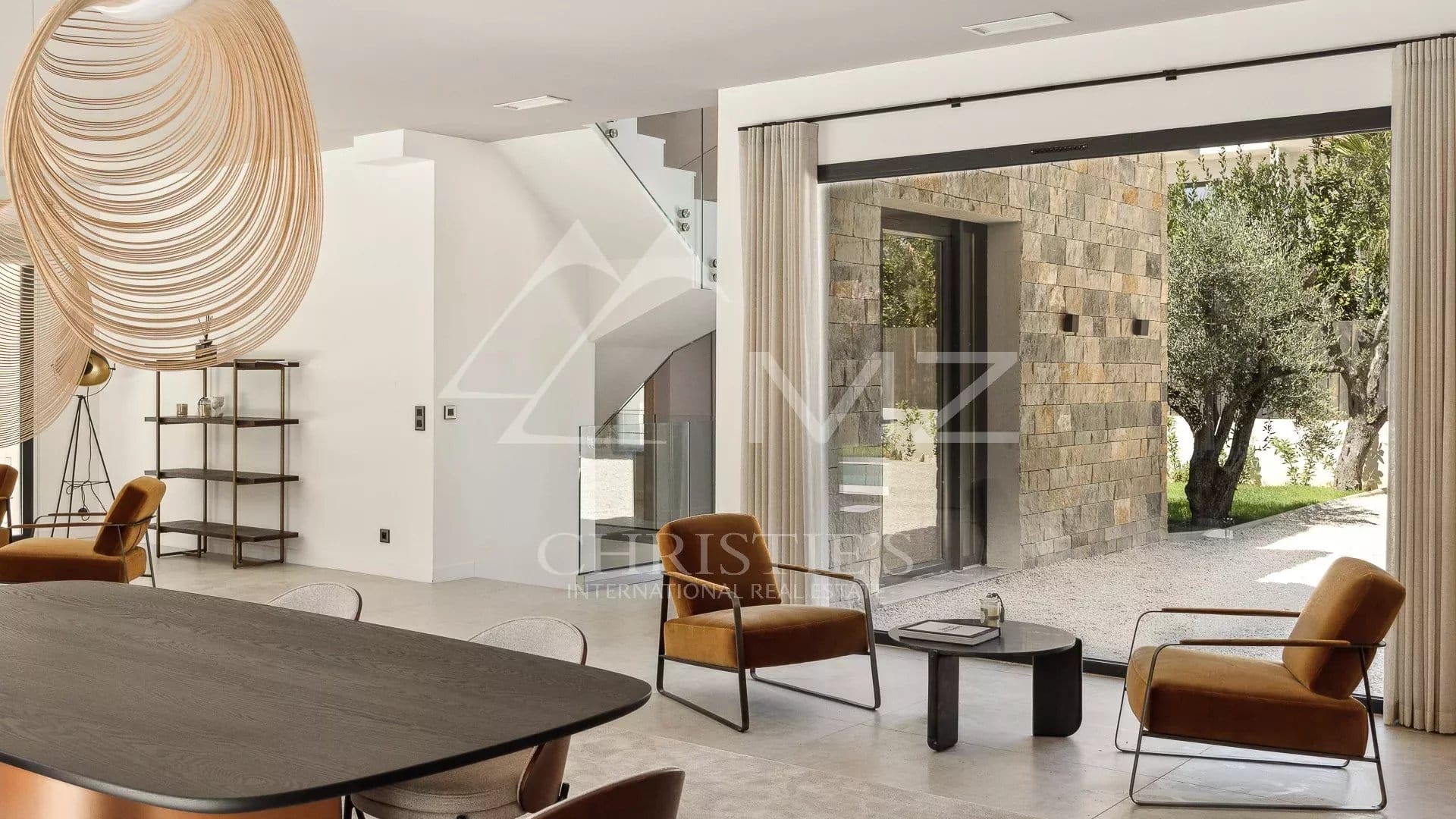 Interior of a contemporary villa in Mougins Interior of a contemporary villa in Mougins, with a modern living room and large windows.