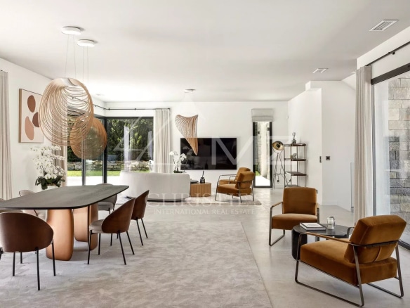 Interior of a contemporary villa in Mougins, bright living room with modern furniture.