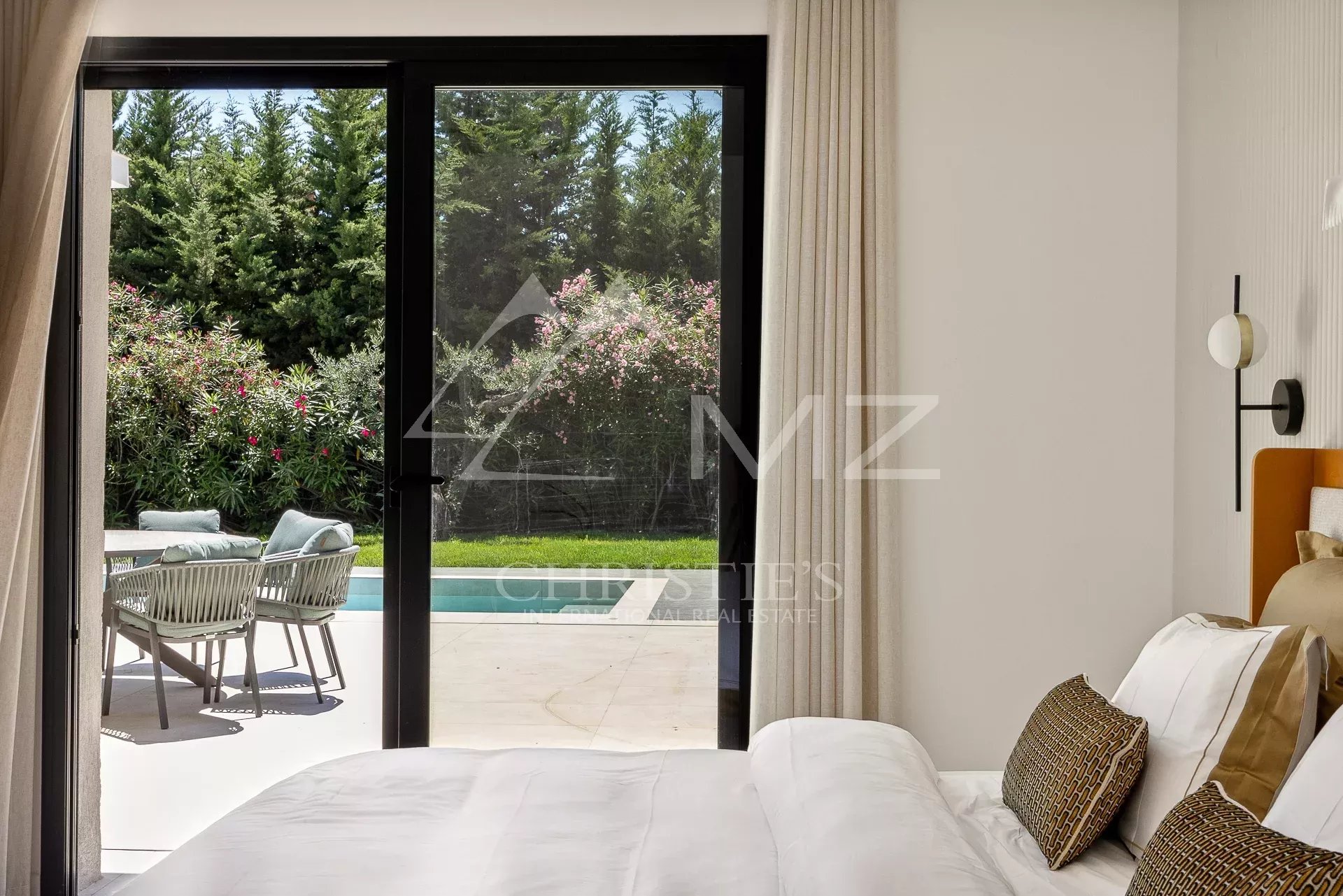 Contemporary villa bedroom in Mougins View from a bedroom with access to the terrace and swimming pool in a contemporary villa in Mougins.