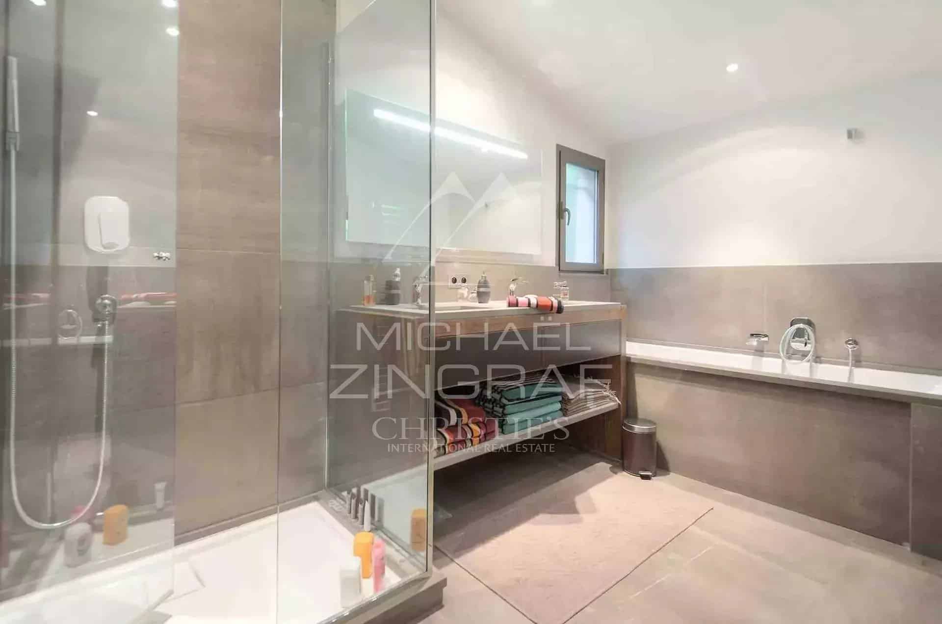 Renovated bathroom Modern bathroom with glass shower and stone countertop.