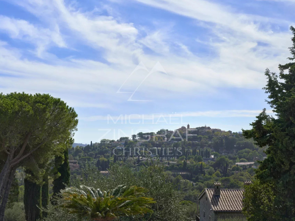Unobstructed view of the Mougins hills and the old village, cloudy sky