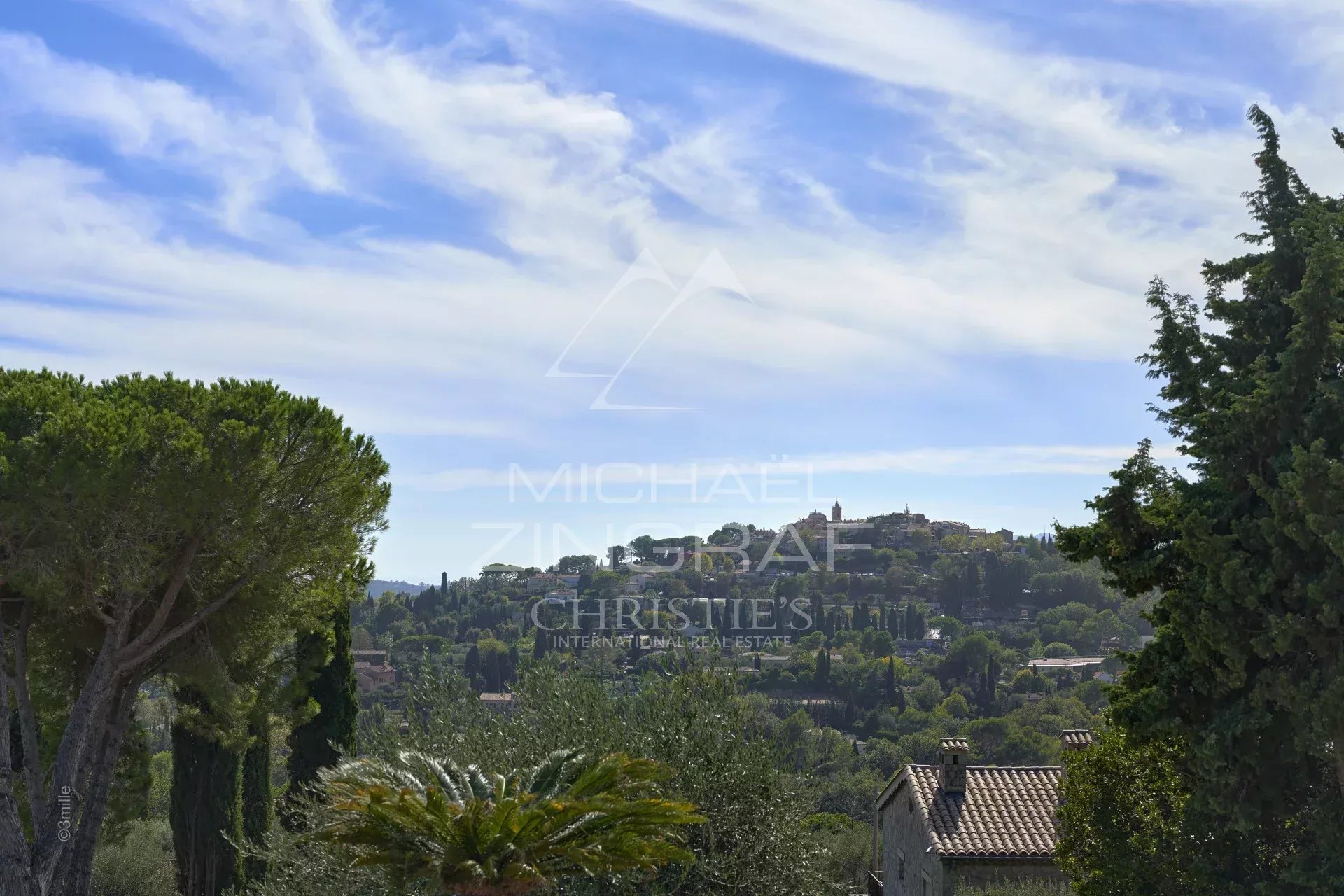 Unobstructed view of the Mougins hills and the old village, cloudy sky