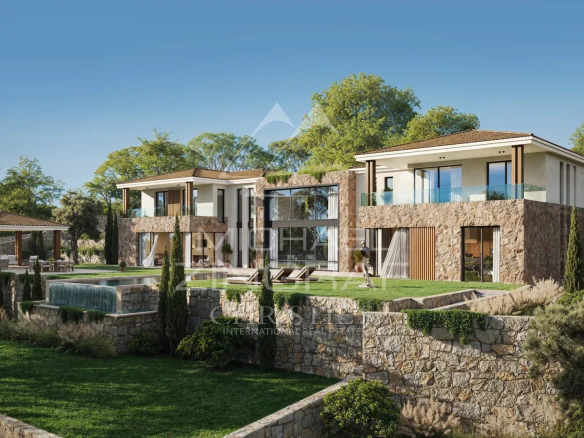 View of a modern villa on a plot with swimming pool and garden in Mougins.
