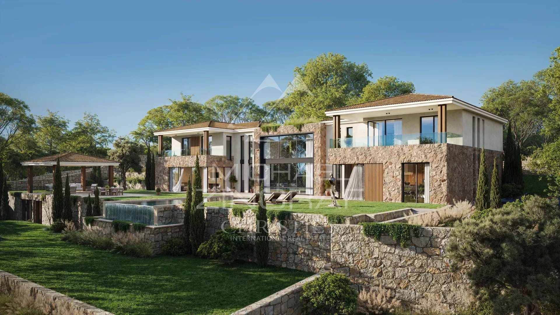 Contemporary country house with swimming pool and panoramic views in Mougins, surrounded by greenery.