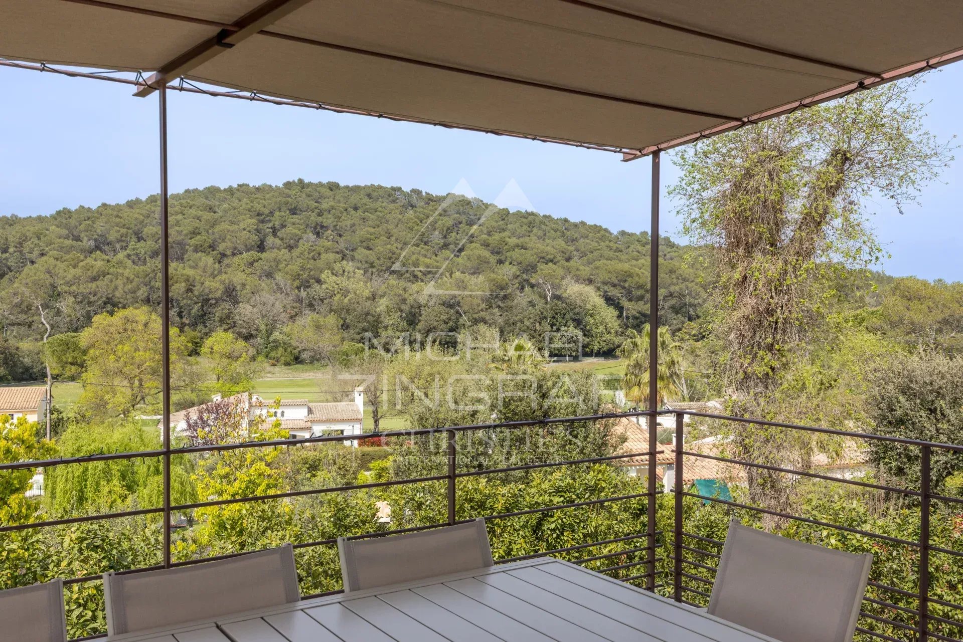 Terrace with a view in Mougins Terrace of a renovated villa with views of nature in Mougins.