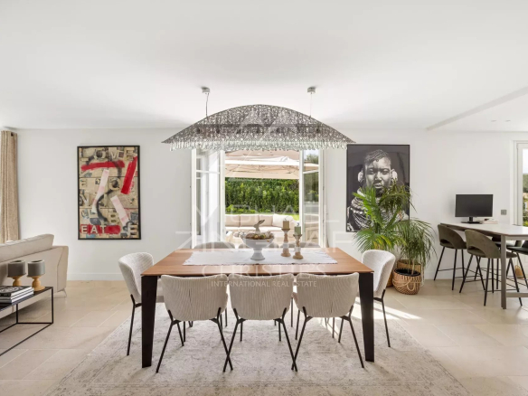 Interior of a renovated villa with elegant dining room and modern decor in Mougins.