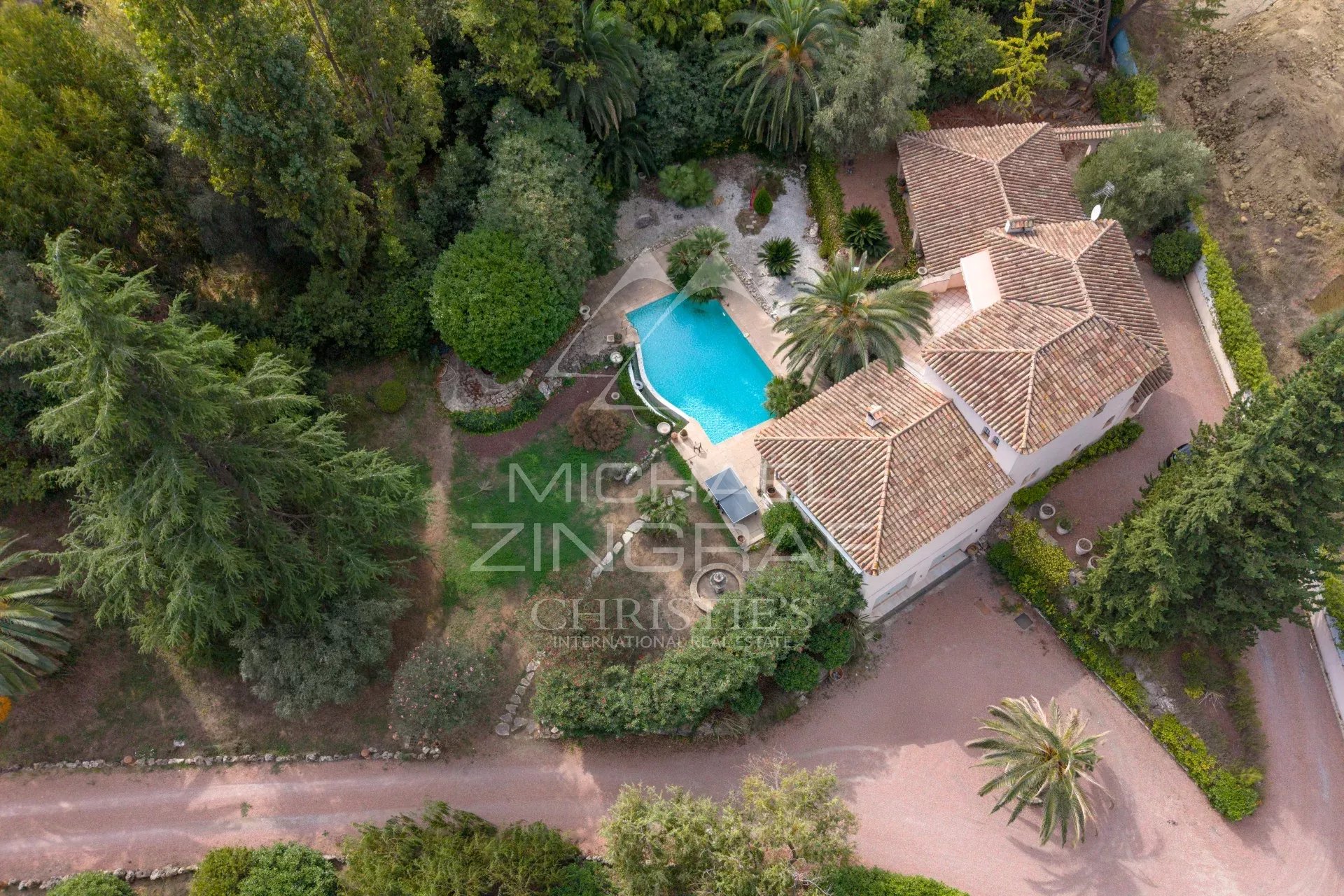 Aerial view of a Provençal villa with swimming pool and garden in Mougins.