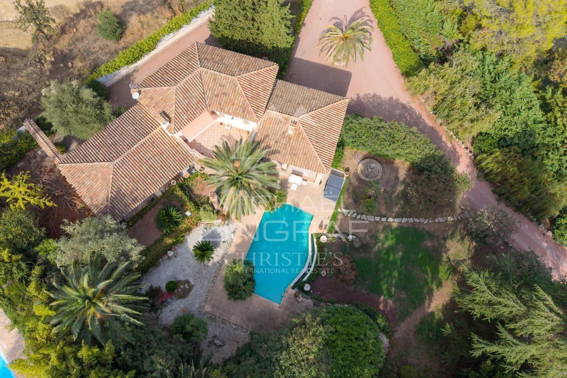 Aerial view of a Provençal villa with swimming pool and garden in Mougins