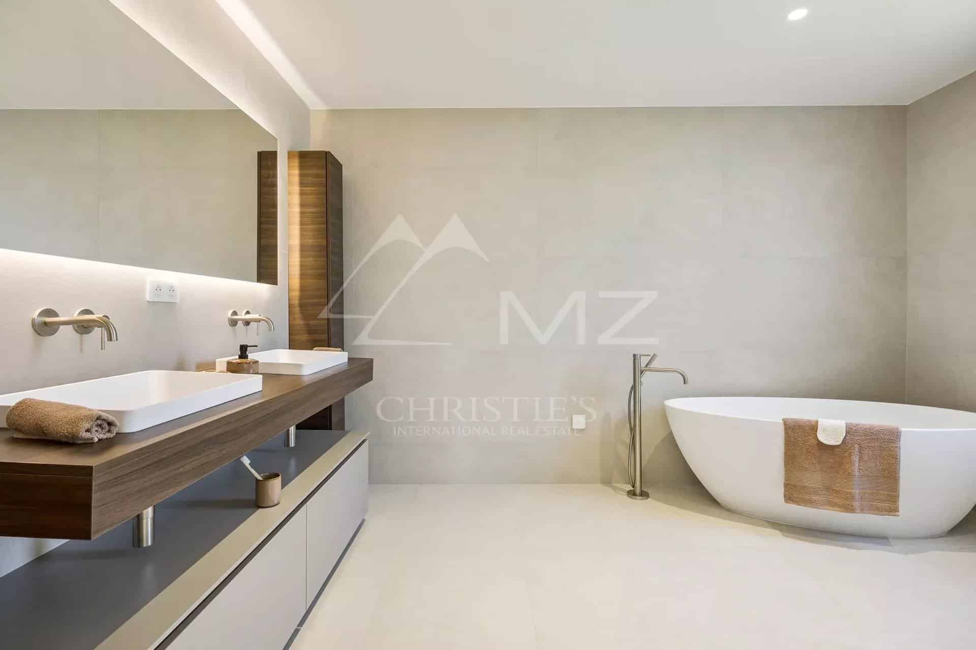 Contemporary bathroom Modern bathroom with bathtub and double sink, minimalist decor.