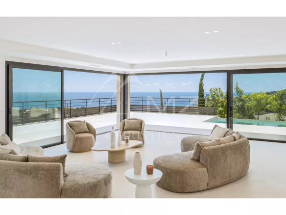 Interior of a contemporary villa with sea views, modern and bright furnishings.