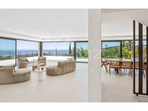 Interior of a contemporary villa with sea views, modern and bright furnishings.
