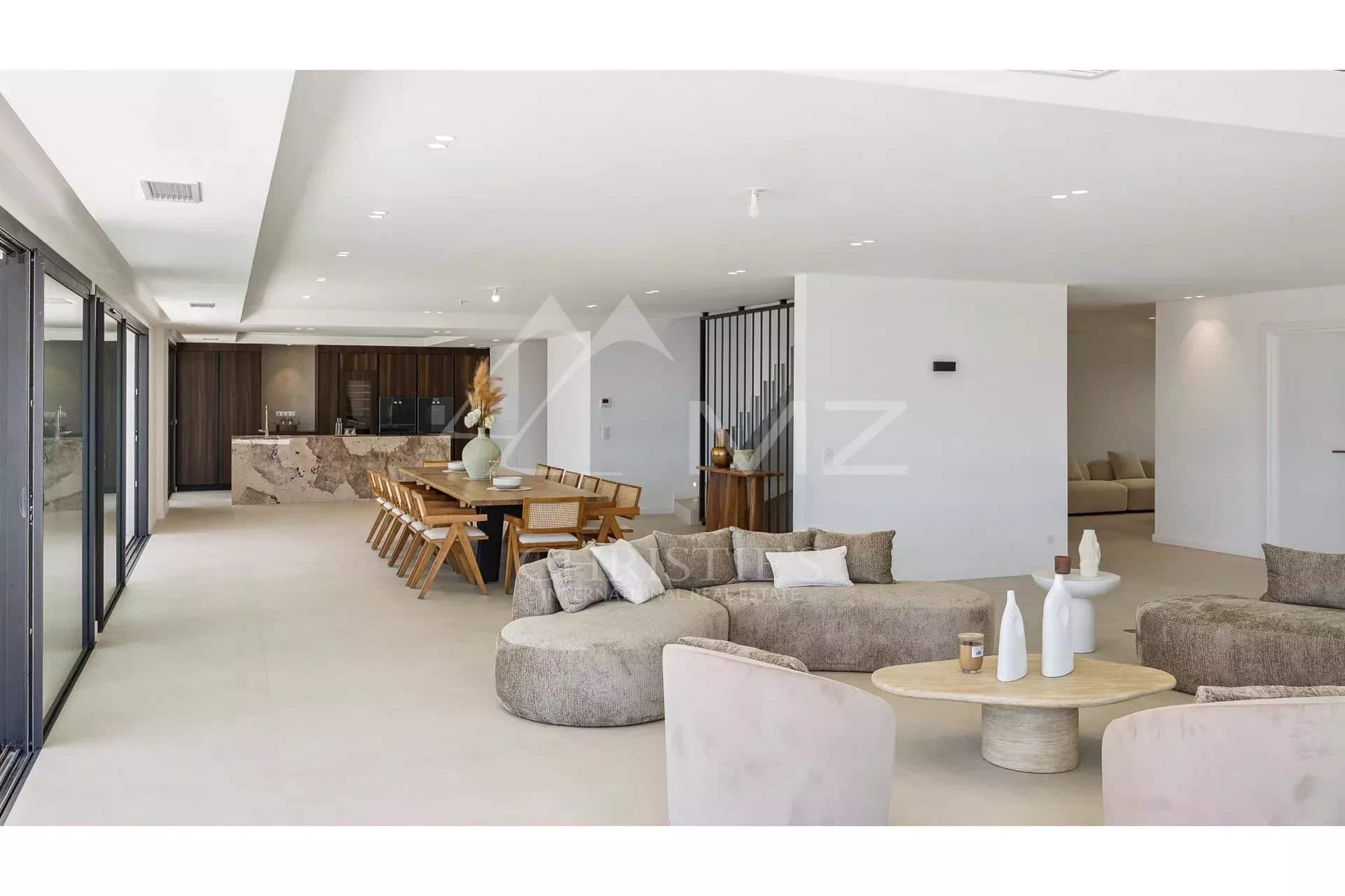 Interior of a contemporary villa Interior of a contemporary villa with spacious living room and dining room, Les Issambres.