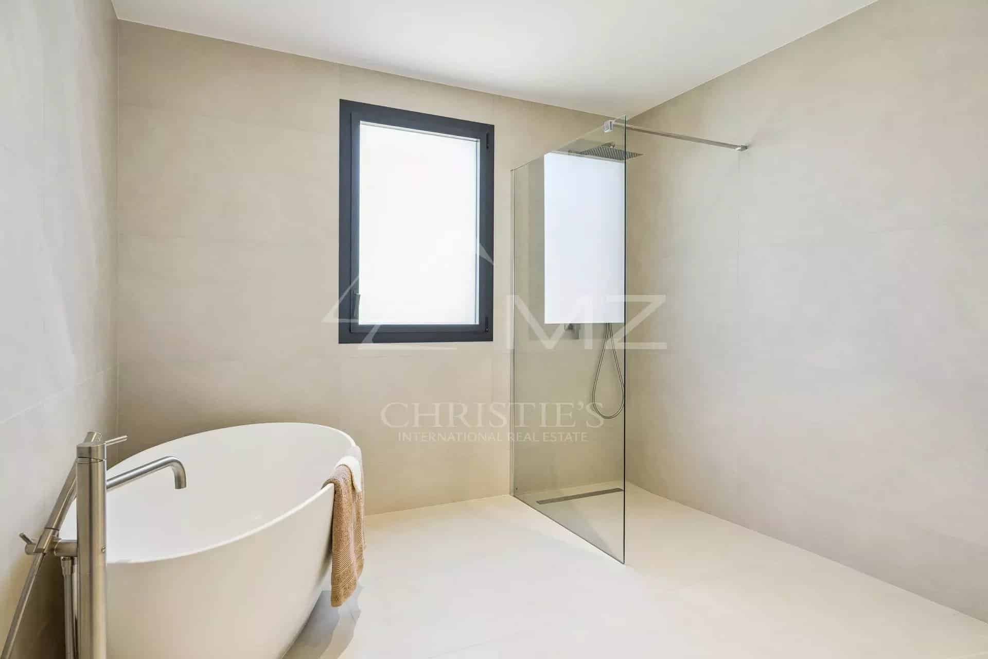 Bathroom of a contemporary villa Modern bathroom with bathtub and shower in a contemporary villa.