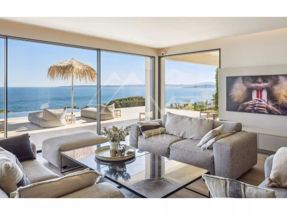 Interior of a contemporary villa with sea views, modern living room and elegant decor.