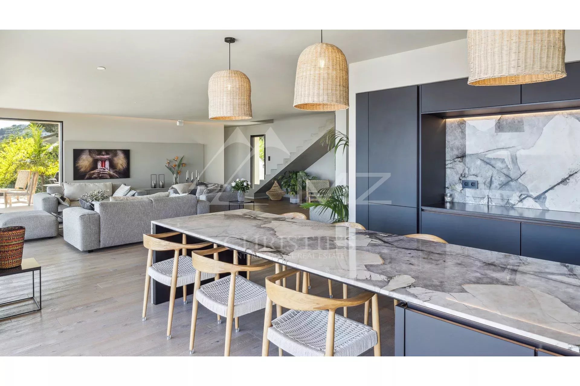 Interior of a contemporary villa with modern kitchen and bright living room in Les Issambres.