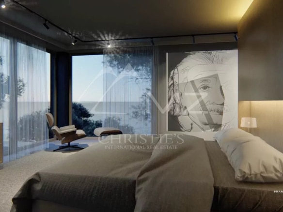Chambre moderne avec vue sur la mer, décorée d'une illustration d'Albert Einstein.