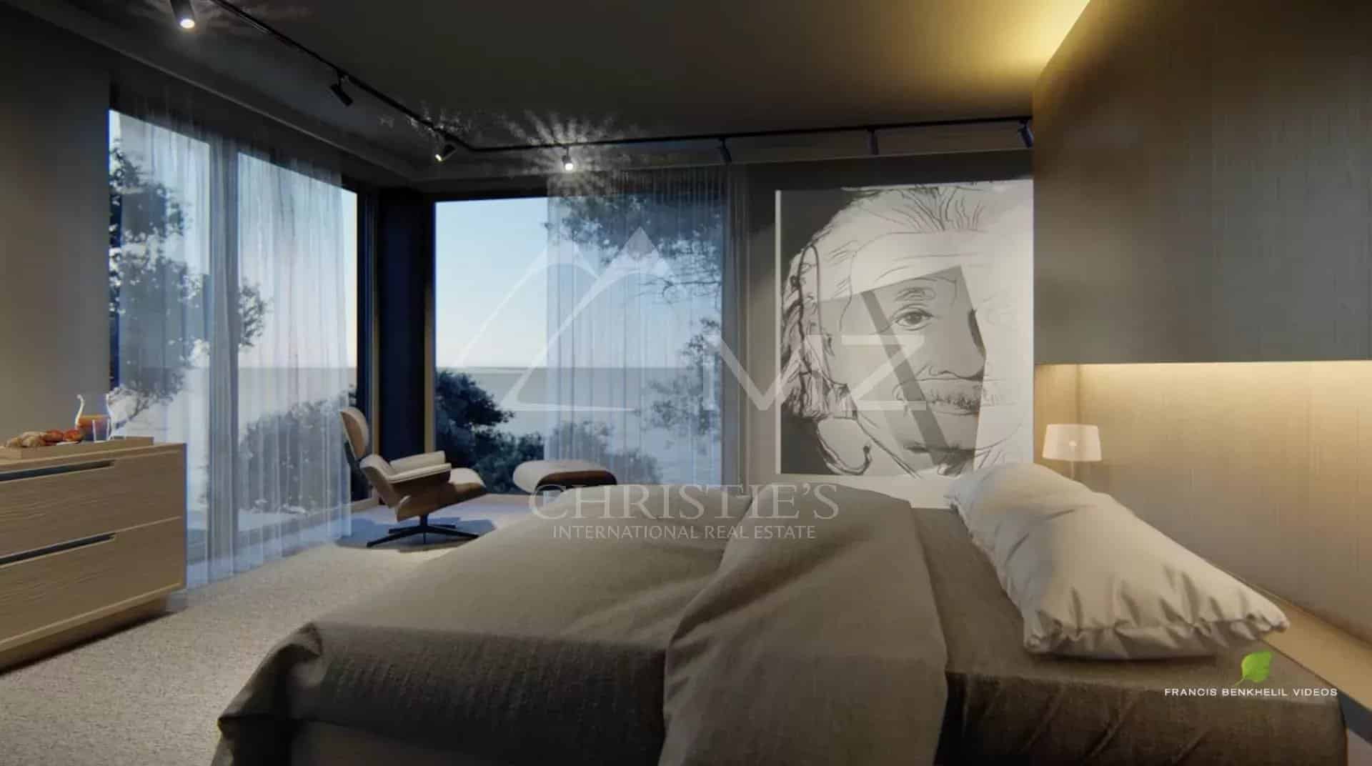 Chambre moderne avec vue sur la mer, décorée d'une illustration d'Albert Einstein.