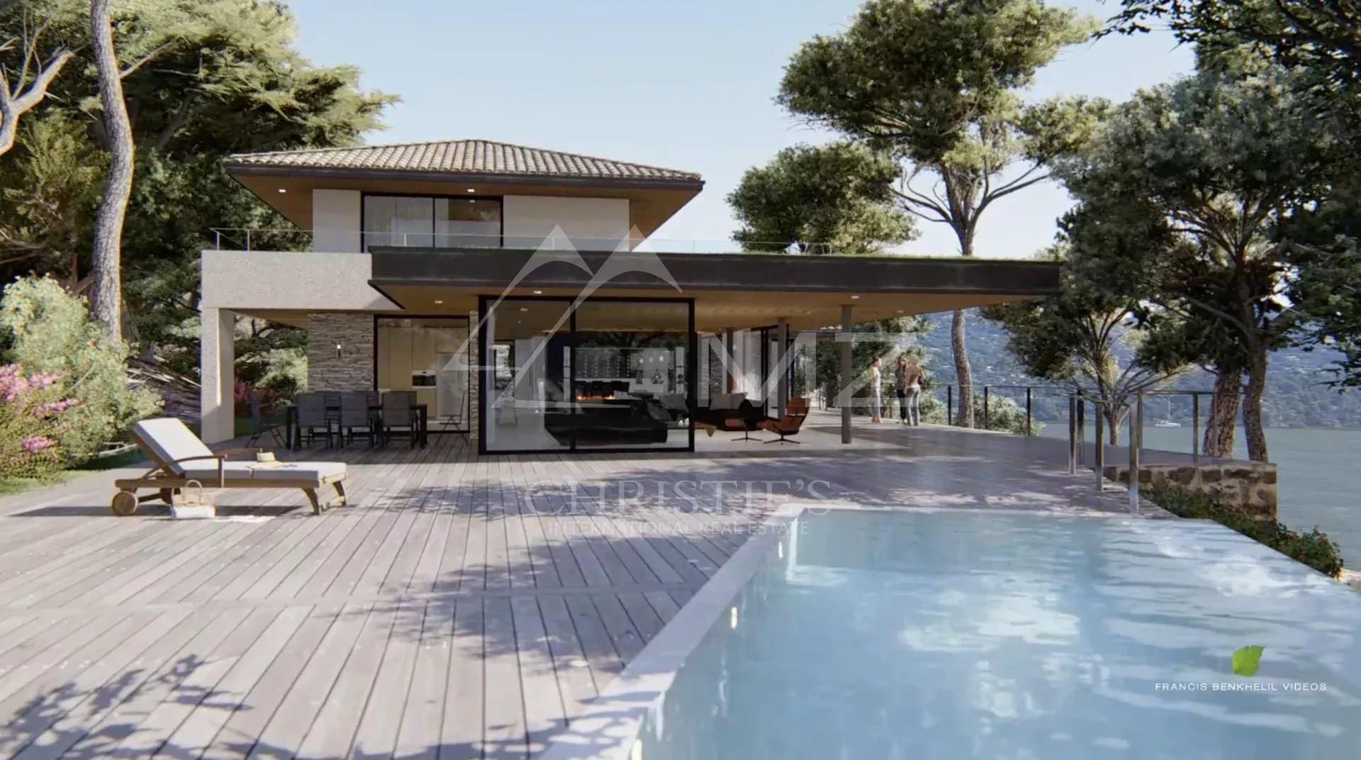 Vue d'une villa moderne avec piscine à débordement et terrasse au Lavandou.