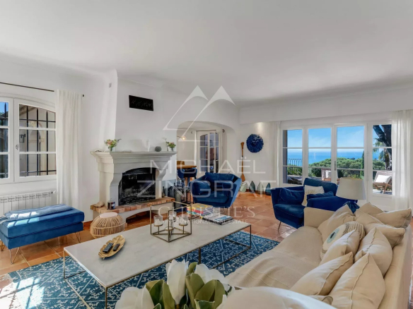 Interior of a neo-Provençal villa with sea views, bright living room and elegant decor.