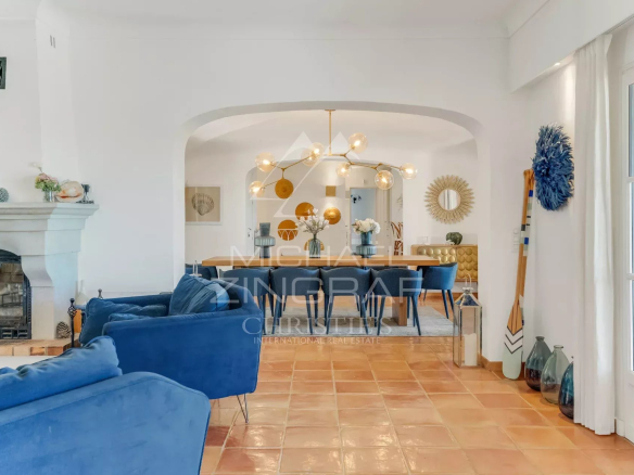 Interior of a neo-Provençal villa with living room and dining room, modern decor in La Croix-Valmer.