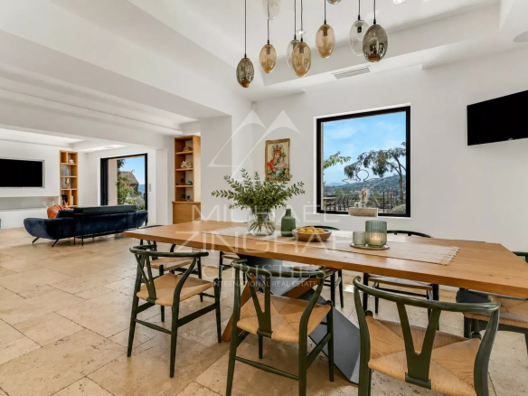 Interior of a modern villa in Sainte-Maxime with dining room and sea view.