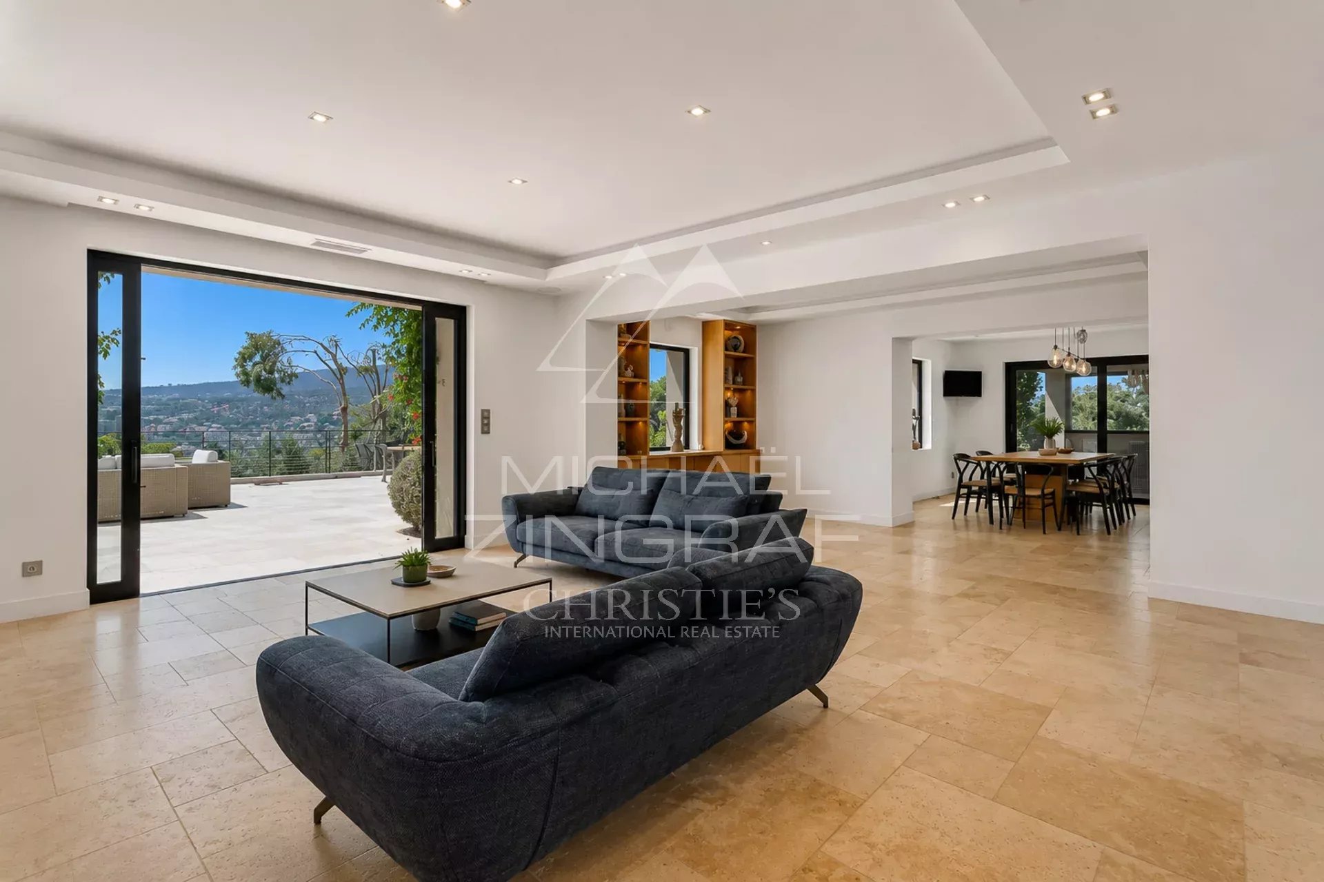 Modern villa in Sainte-Maxime Interior of a modern villa in Sainte-Maxime with a spacious living room and access to the outside.