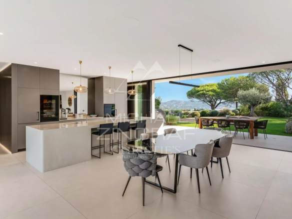 Modern interior of a contemporary villa overlooking the garden and the Gulf of Saint-Tropez.