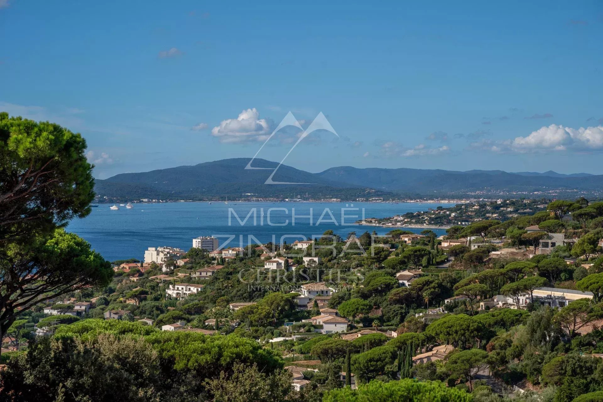 View of the Gulf of Saint-Tropez Panoramic view of the Gulf of Saint-Tropez from Sainte-Maxime, with hills and houses.